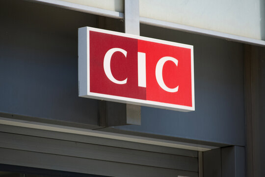 Bank CIC red company logo sign outside financial branch building in Zurich