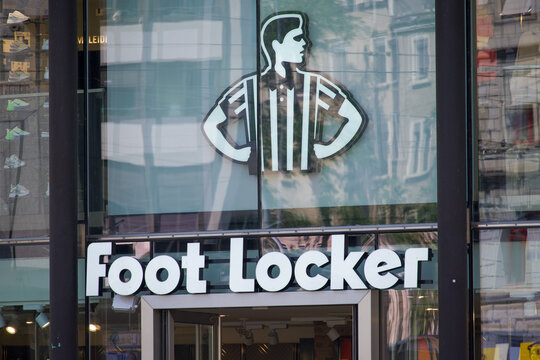Foot Locker logo sign and referee emblem on store entrance facade in Zurich