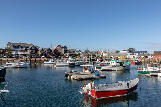 scenic view to rockport old Marina with village with traditional wooden houses in background
