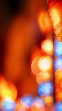 Blurred glowing lantern lights at aomori nebuta matsuri, red orange blue bokeh, summer festival night parade atmosphere, illuminated floats, motion blur, abstract celebration background copy space