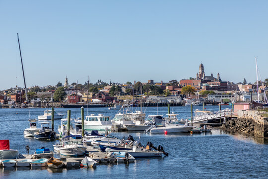 view from Marina in Gloucester to old town with church, yachts and typical wooden scenic houses