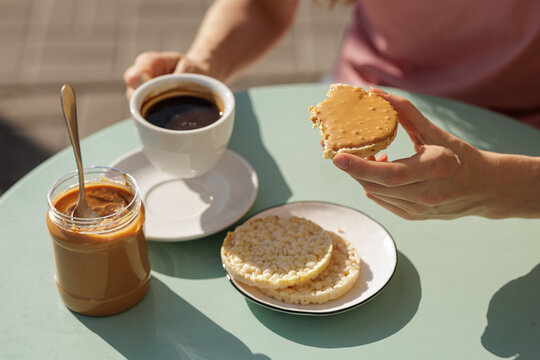 Peanut Butter Spread On Rice Cake With Coffee For Snack