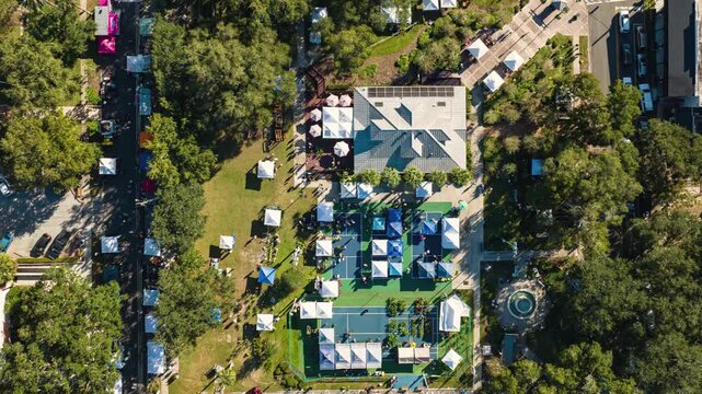 Aerial top down view of vendor tents at the annual plant sale in Mount Dora Florida, USA.  A time lapse video. 