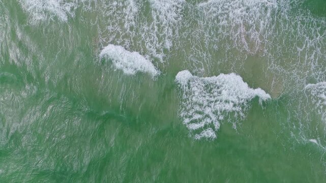 Aerial view on rippled surface. Sea water surface. Ripple water of ocean. Aquamarine ocean nature. Background clear turquoise sea water. Idyllic summer vacation. Mediterranean sea