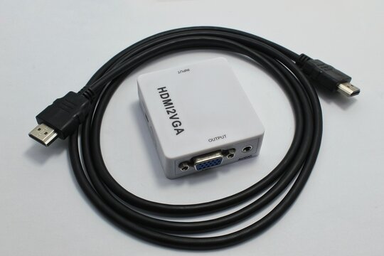HDMI Cable and HDMI to VGA Converter Isolated on White Background
