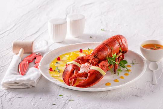 Exclusive cooked lobster prepared in butter and orange sauce.