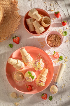 Cold and homemade strawberry ice cream for hot summer day.