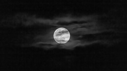 Full moon in the night sky with clouds © ric