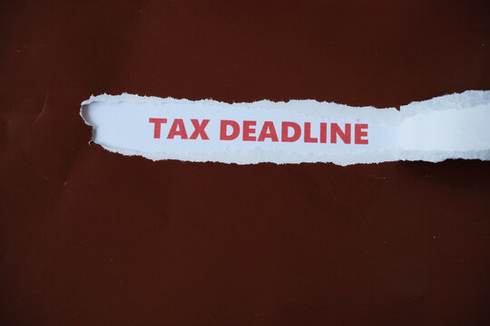 The tax payment deadline is written under the torn paper.
