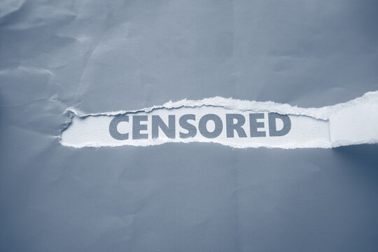 The words "CENSORED" are written on the back of torn paper. A warning for content or something that should not be shown to the public.