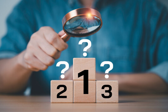 Business analysis and ranking concept with magnifying glass evaluating priority options, strategic decision making, critical thinking, performance assessment, comparison, and business planning.