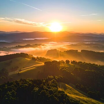 Sunrise over rolling hills and landscape.