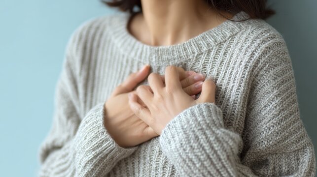 hand hold chest with heart attack symptoms, have chest pain caused by heart disease, leak, dilatation, enlarged coronary heart, press on the chest with a painful expression