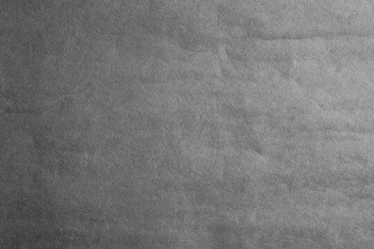 Dark gray crumpled texture of paper