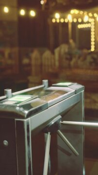 The scene captures a turnstile standing open, inviting guests into a vibrant market filled with warm lights and enchanting aromas. Evening hints linger as excitement grows.