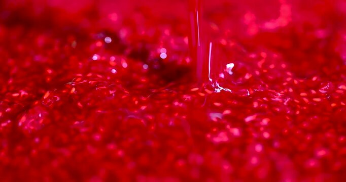 The berry mass of red grated raspberries, homemade grated raspberries from juicy fruits are evenly distributed on the surface
