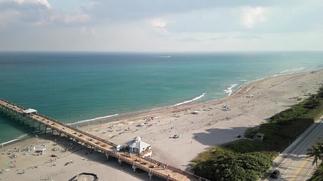 Flying along the coastline at Juno Beach Pier in Palm Beach County, Florida. 