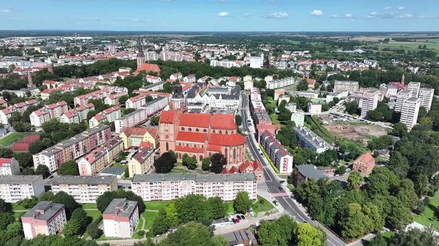 Stargard Poland city center church parks apartments circle 2. Northern Poland in 8th century. Historical stronghold, defensive walls, gates towers. WW II POW camp controlled by Germany. Brick church.