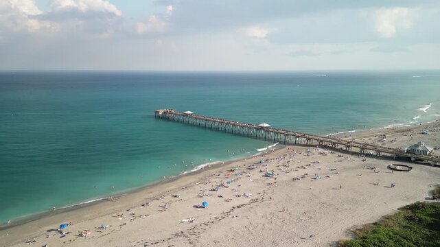 Flying along the coastline towards Juno Beach Pier in Palm Beach County, Florida. 