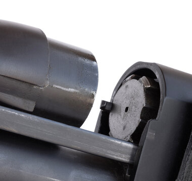 Barrel and chamber being removed from a shotgun receiver