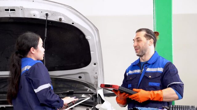 Automotive mechanic car repair garage tool uniform technician hood inspection vehicle diagnostic maintenance service team in modern workshop open car hood digital check garage workflow