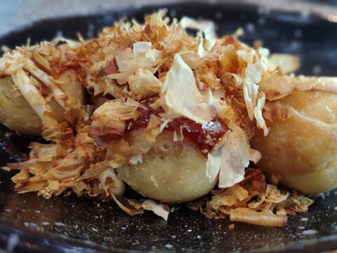 Close up Photo of Delicious Japanese Takoyaki Balls Topped with katsuobushi.