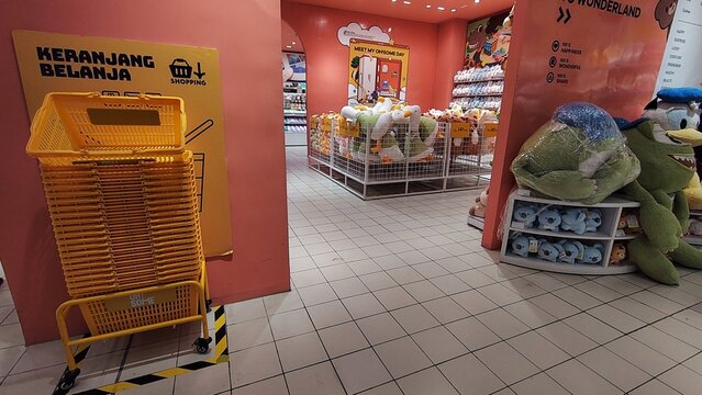 Empty Shopping Cart in a Brightly Lit Oh! Some Store.