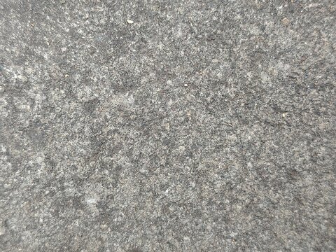 Close-up Texture of Speckled Gray and Green Granite Stone Surface.