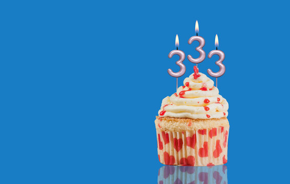 Birthday Or Anniversary Cupcake With Lit Candles; Candles Forming The Number 333
