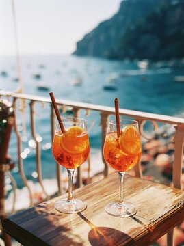 Charming Amalfi Coast Scene with Aperol Glasses in Sunlight