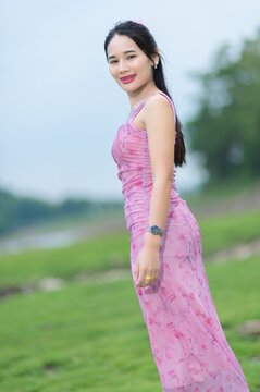 Young Woman in Pink Outfit by Sai Thong Reservoir, Nakhon Nayok