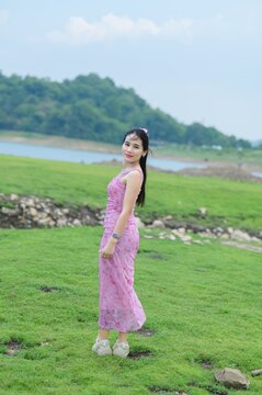 Young woman in pink outfit at Sai Thong Reservoir in Thailand