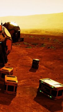 Under a golden sky, explorers arrive on a desolate red planet, carefully setting down glowing crates as they prepare to uncover the secrets of this alien landscape and its mysteries.