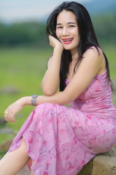 Woman in Pink Dress Smiling by Sai Thong Reservoir in Thailand