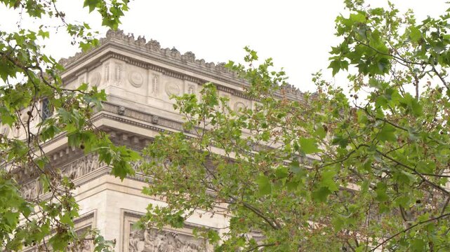 Arc de Triomphe Monument Behind Green Tree Branches in Paris