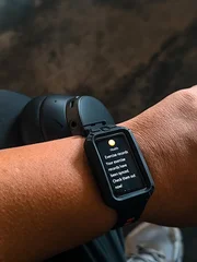 Smartwatch Displaying Health Notification on Person's Wrist © pixelbleed