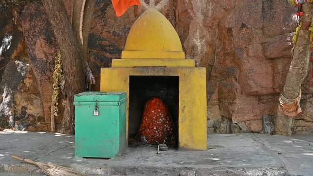 Sacred Mahadev Shivling Shrine Inside Small Temple Near Rocky Cave, Lord Shiva Hindu Worship Place, 4K Footage
