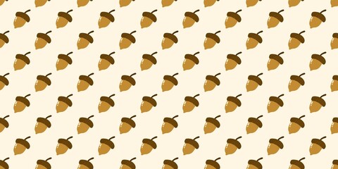 Seamless acorns pattern. Cute cartoon acorns on light cream background. Perfect for autumn wallpaper and fall textile design. © Enka Enka