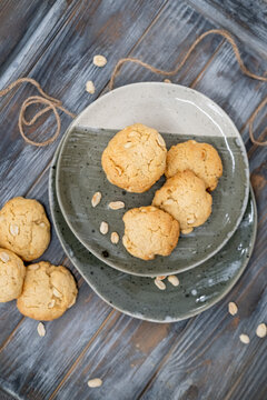 Homemade dessert. Crunchy biscuits. Round cookies baked with peanut served on gray dish. Tasty crispy meal culinary recipe background.