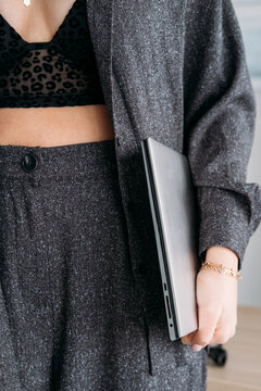 Laptop work. Freelance lifestyle. Unrecognizable stylish business woman specialist with computer for professional career routine.