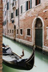 Traditional gondola on a quiet canal in Venice, Italy © Giovanna Ponce Leon