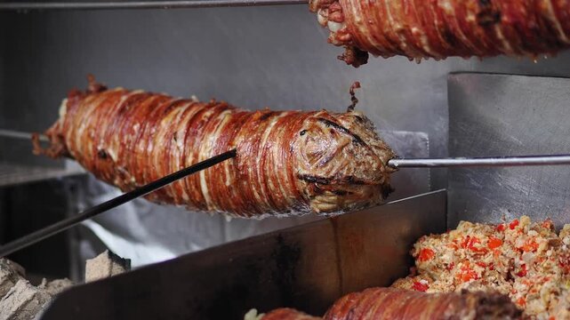 Traditional Turkish Kokorec Roasting on a Spit