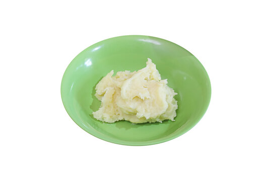 Creamy mashed potatoes in green plate isolated on transparent background photo