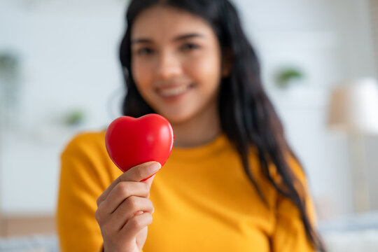 Close-up hand of asian woman holding red heart. Concept of health insurance, charity volunteer donation, CSR responsibility, world heart day, world health day, self love