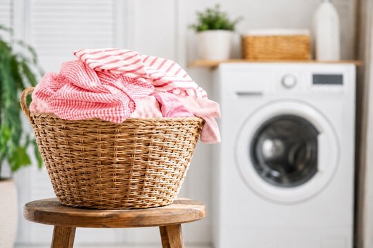 Laundry Basket with Clothes in Laundry Room