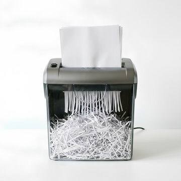 Paper Shredder with Shredded Documents Inside.