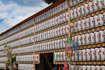 Naklejka premium Massive array of japanese paper lanterns with tanabata decorations at shrine