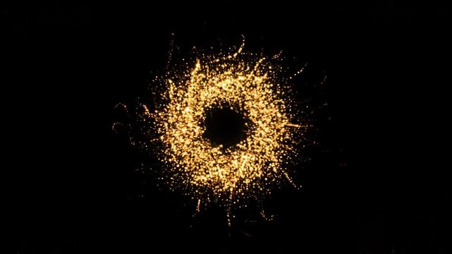 Golden particles contracting and collapsing into a bright light