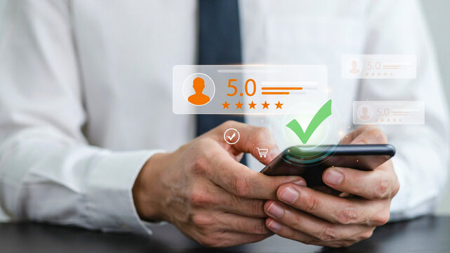 Businessman holding smartphone giving top 5 star rating customer review online service feedback satisfaction score on mobile phone