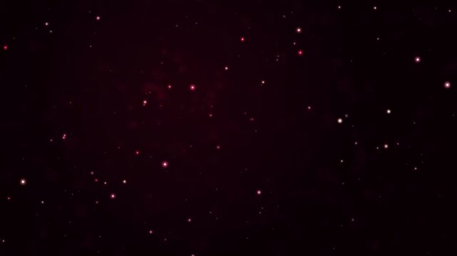Abstract glowing red particles slowly drifting through dark deep space creating ethereal magical movement